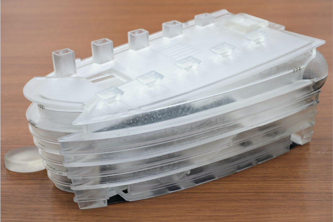 The fully stacked 3D print, which stacked the 1st, 3rd, 5th, 7th floors, and the roof. The building has a boat shape, with the “bow” on the left side.